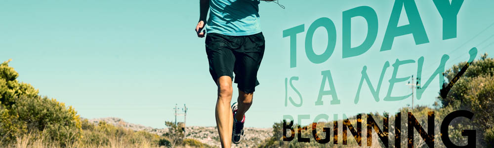 Body of a fit man running outside along a back road, with "today is a new beginning" written on the right side Body of a fit man running outside along a back road, with "today is a new beginning" written on the right side